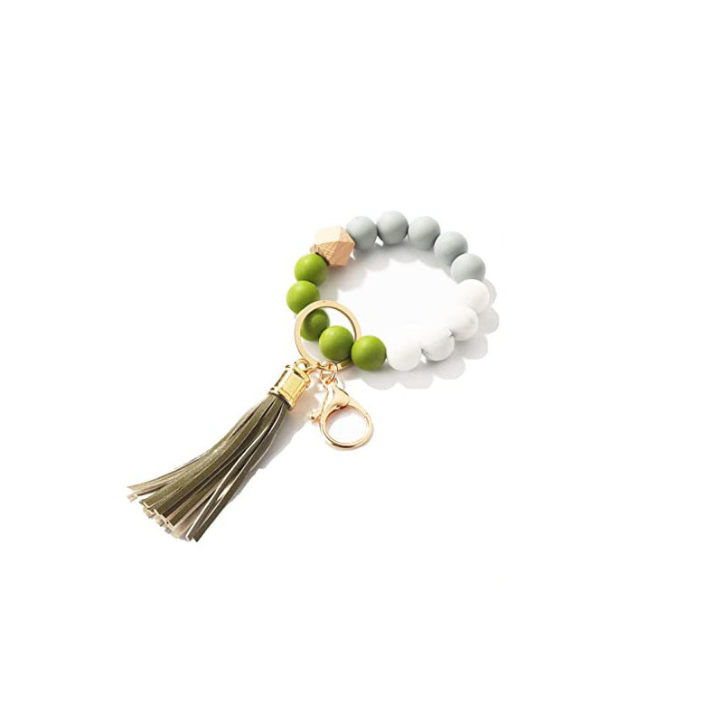 Llavero al por mayor de la muñeca de la mano de la borla del cuero del cordón del silicón del estampado de leopardo